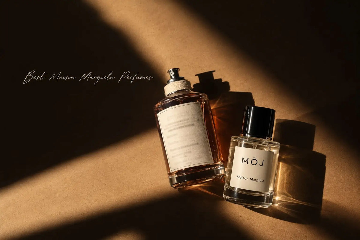 MOJ Maison Margiela perfume bottle with black cap beside a Maison Margiela Replica bottle with a canvas-wrapped neck, both lying on brown kraft paper in hard sunlight and shadow