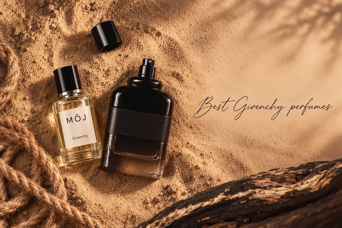 MOJ Givenchy inspired perfume beside a Givenchy Gentleman Eau de Parfum bottle on desert sand
