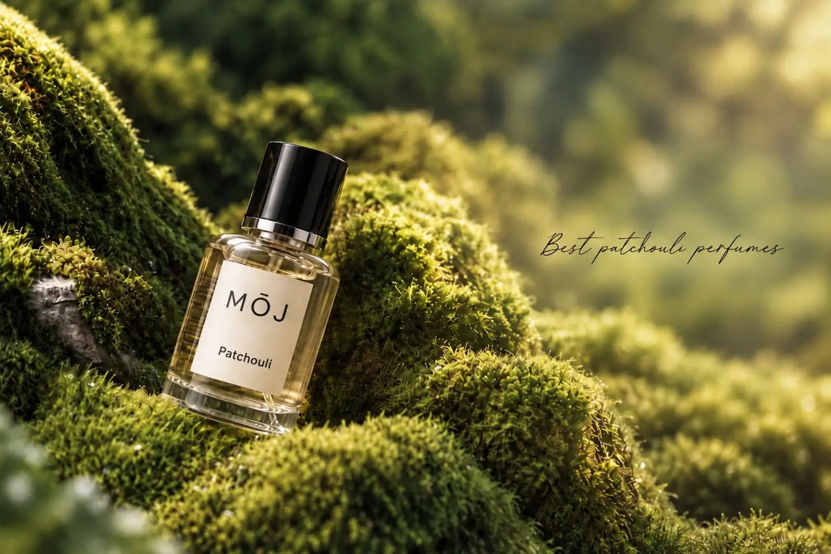 MOJ Patchouli perfume bottle resting on green moss in sunlight